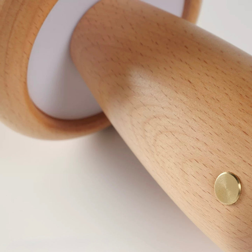 Wooden Mushroom-shaped lamp with a gold circular detail on a white background