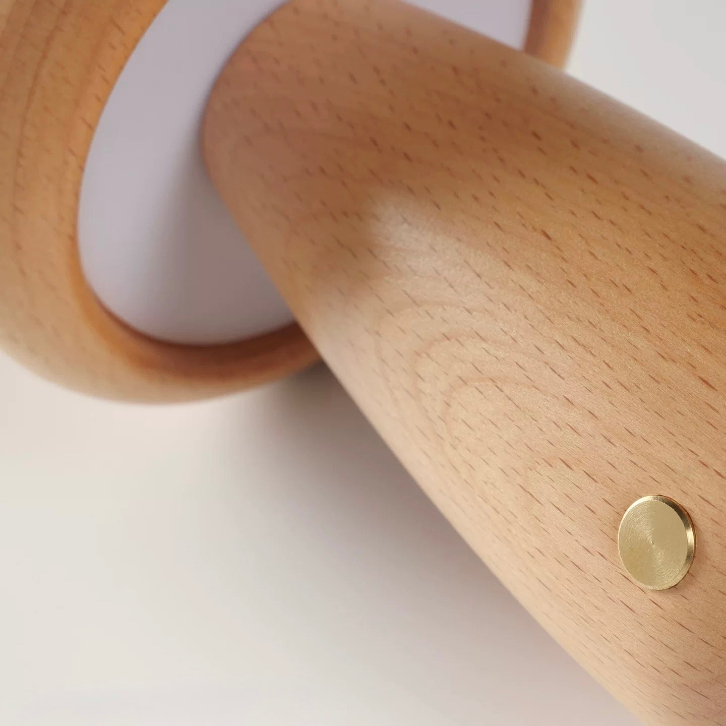 Wooden Mushroom-shaped lamp with a gold circular detail on a white background