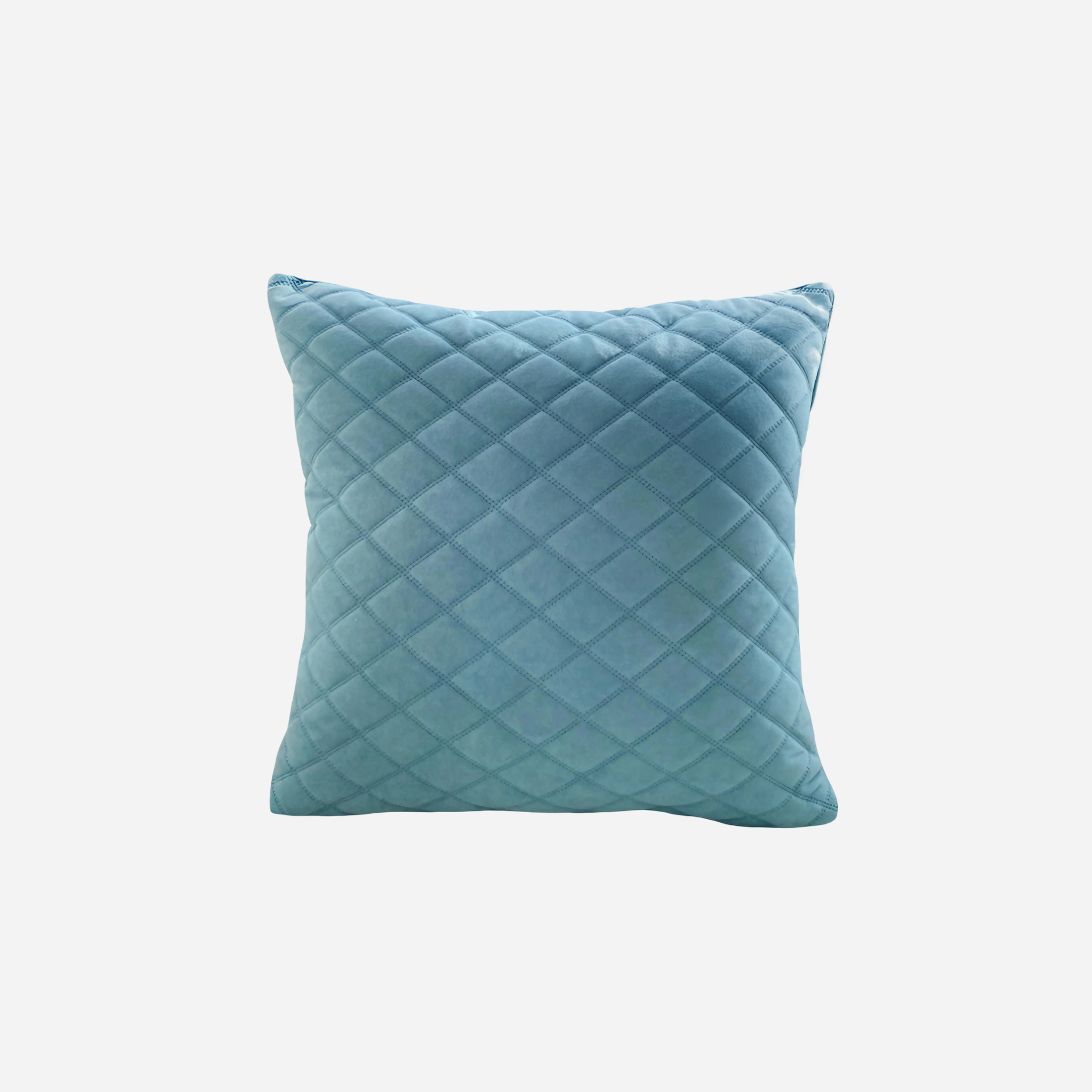 Blue quilted pillow on a white background