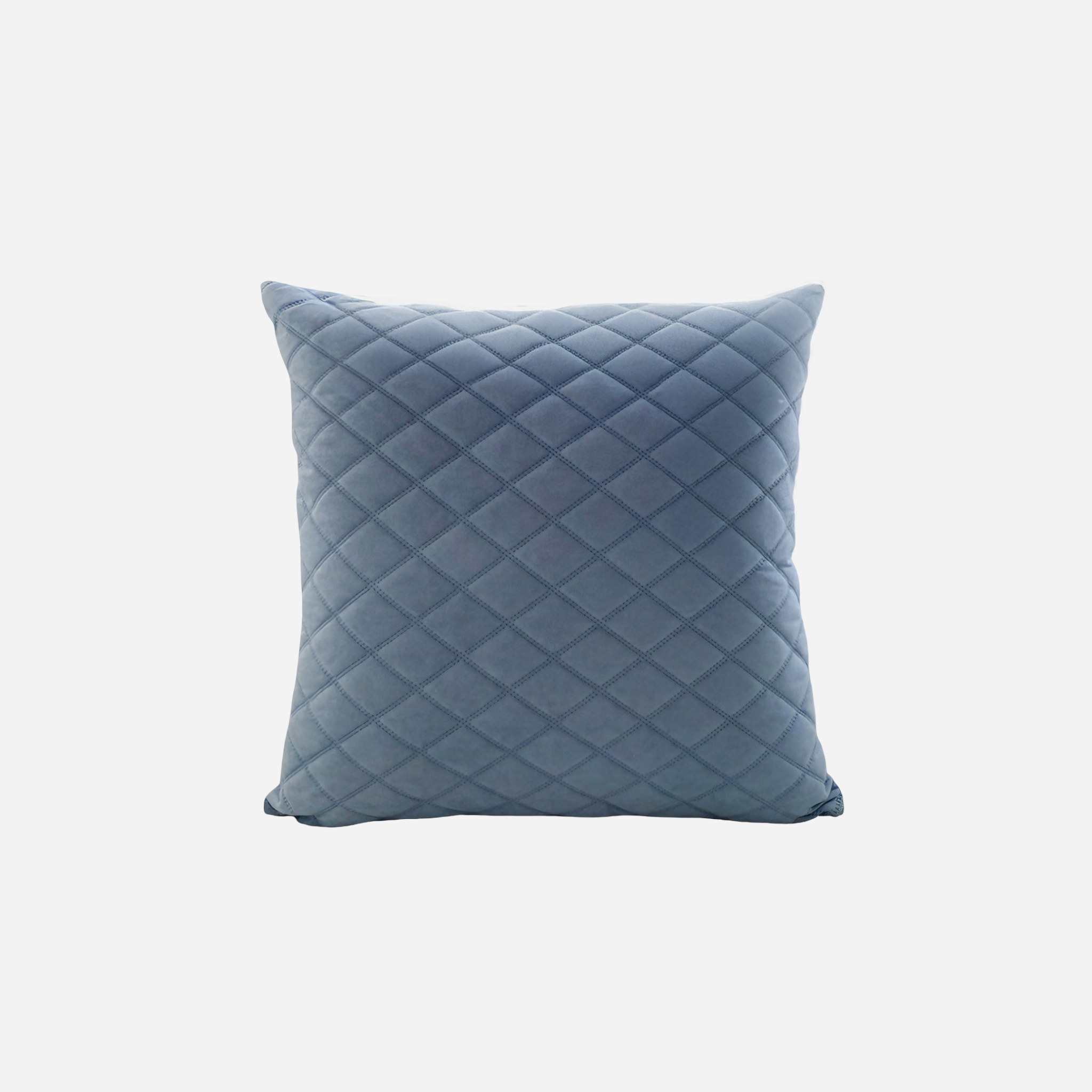 Blue quilted pillow on a white background