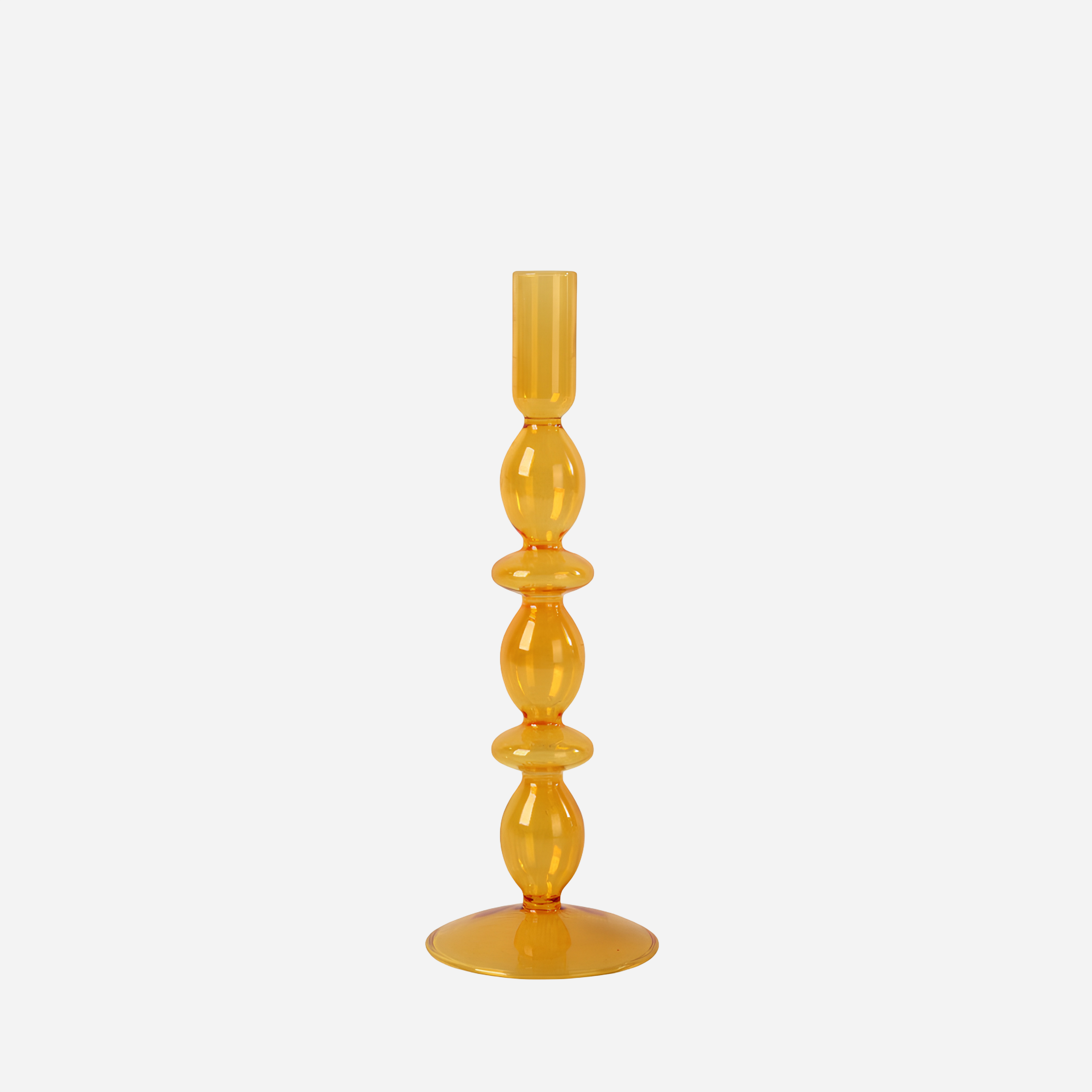 Orange glass candle holder on a white background